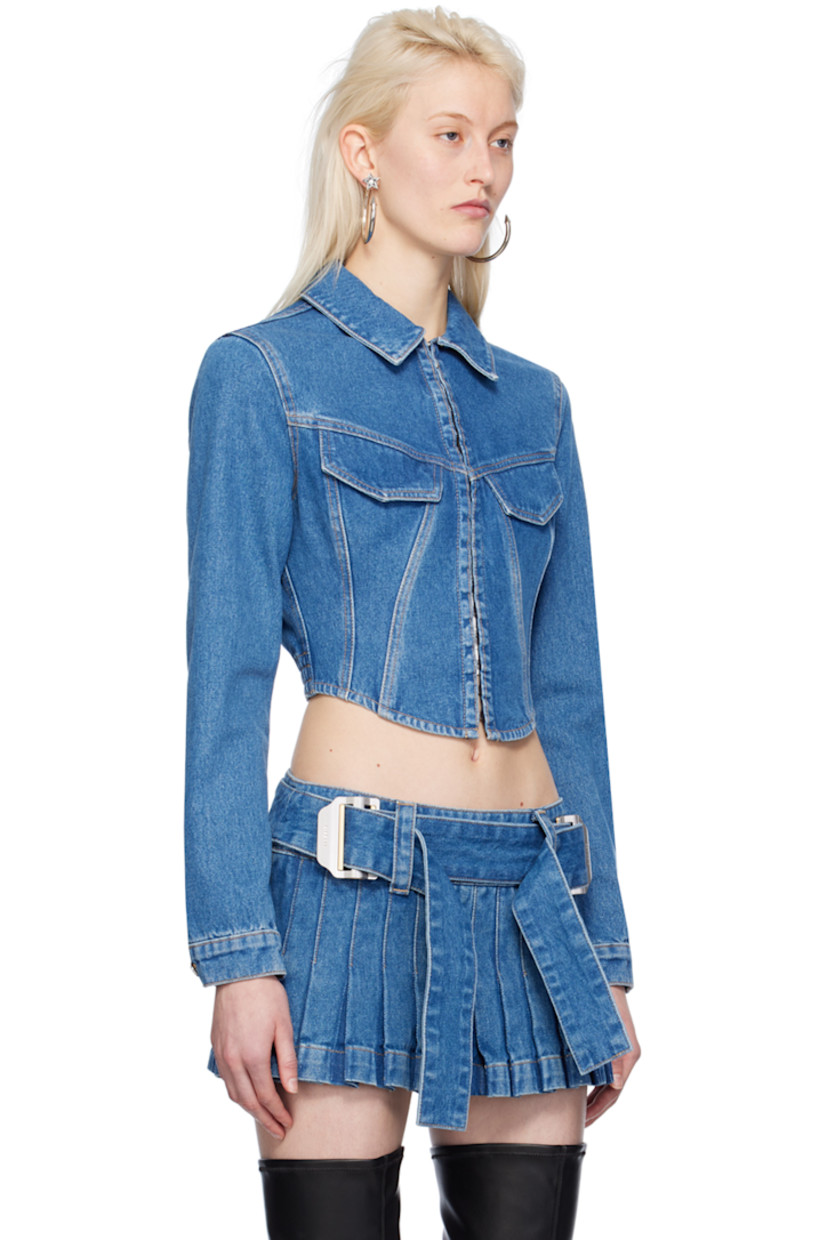 Heavyweight garment-dyed non-stretch denim jacket.

· Spread collar
· Hook-eye closure
· Flap pockets
· Boning at partially elasticized corset-style hem
· Single-button barrel cuffs
· Contrast stitching in tan

Supplier color: American blue
