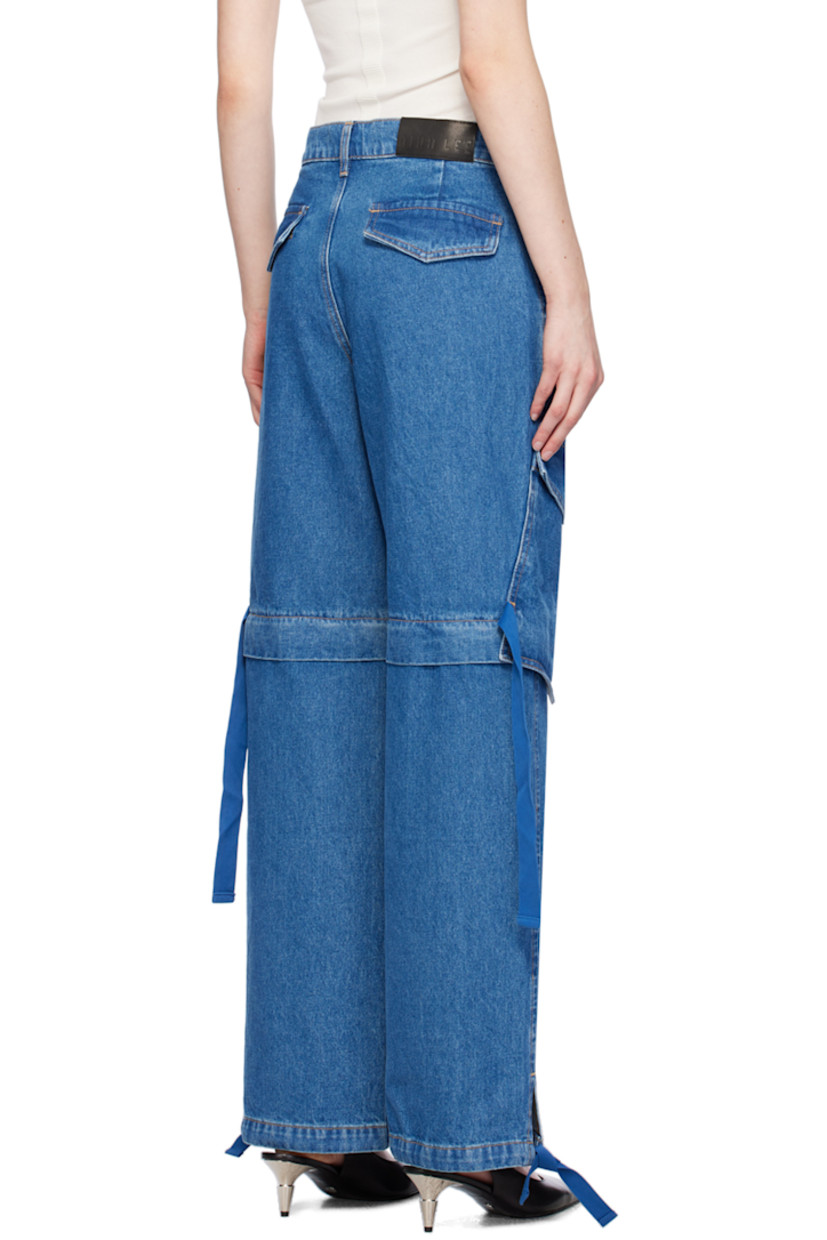 Relaxed-fit straight-leg non-stretch denim jeans. Fading throughout.

· Belt loops and concealed drawstring at waistband
· Four-pocket styling
· Zip-fly
· Detachable panel at legs
· Drawstring at vented cuffs
· Cargo pocket at outseams
· Leather logo patch at back waistband
· Contrast stitching in tan

Supplier color: American blue