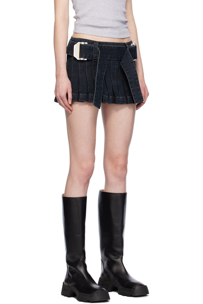 Non-stretch denim skirt. Fading, topstitching, and knife pleats throughout.

· Low-rise
· Belt loop and integrated cinch belt
· Zip closure at side

Supplier color: Washed black