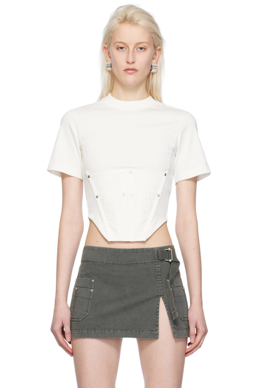 Organic cotton jersey T-shirt.

· Rib knit crewneck
· Utility pocket and rivets at front
· Boning at front
· Asymmetric hem
· Logo-engraved silver-tone hardware

Supplier color: Ivory