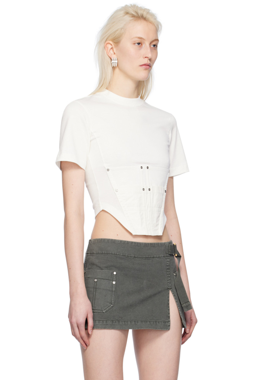 Organic cotton jersey T-shirt.

· Rib knit crewneck
· Utility pocket and rivets at front
· Boning at front
· Asymmetric hem
· Logo-engraved silver-tone hardware

Supplier color: Ivory