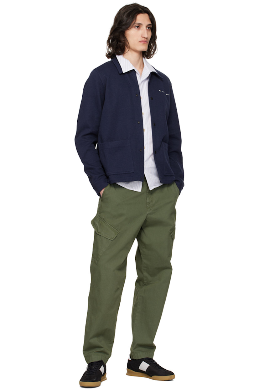 Plain-woven cotton shirt. Stripes and laddering throughout. 

· Button tab at open spread collar
· Button closure
· Tennis-tail hem
· Logo flag at side seam

Supplier color: Whites