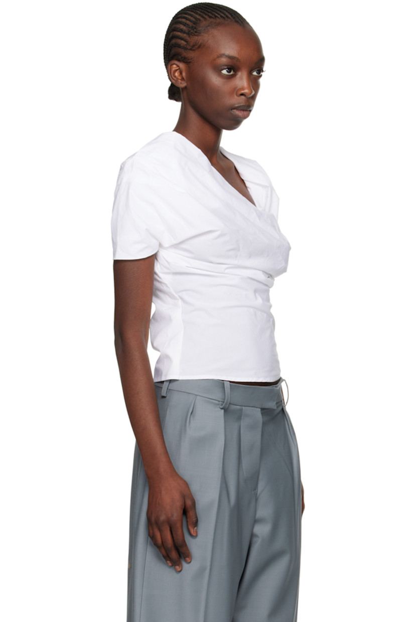 Cotton poplin blouse. Gathering throughout.

· Wrap and layered construction
· Frayed detailing at modified open placket
· Concealed zip closure at side seam and front
· Partial plain-woven organic cotton lining

Supplier color: Bianco