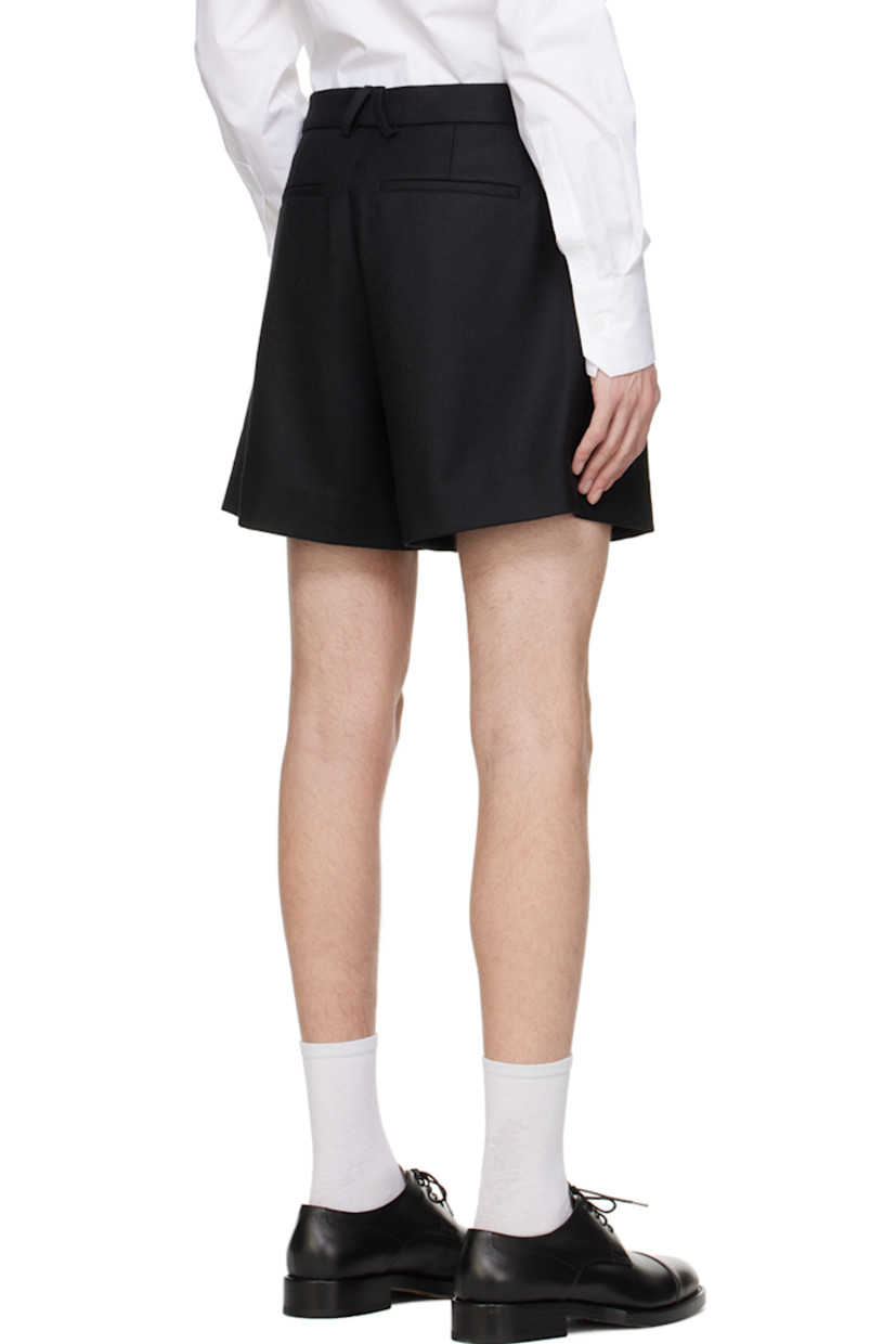 Virgin wool-blend twill shorts.

· Belt loops
· Four-pocket styling
· Button-fly
· Pleats at front
· Unlined

Available exclusively at SSENSE.

Supplier color: Black