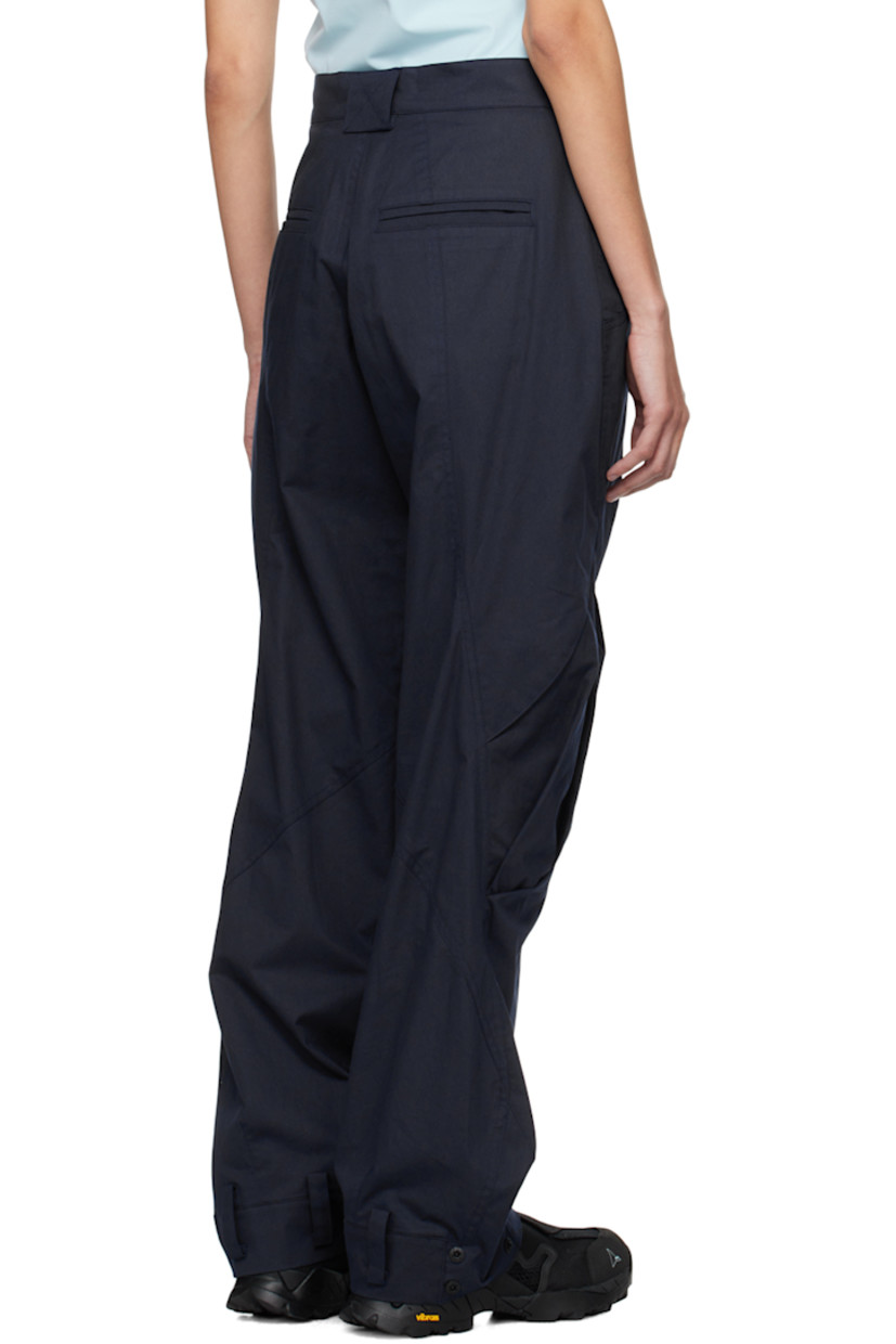 Cotton twill trousers. 

· Paneled construction
· Belt loops
· Four-pocket styling
· Zip-fly
· Pleats at front
· Loops and press-stud fastening at cuffs 
· Flap pocket at outseams 

Supplier color: Navy