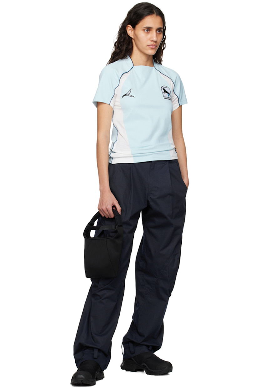 Cotton twill trousers. 

· Paneled construction
· Belt loops
· Four-pocket styling
· Zip-fly
· Pleats at front
· Loops and press-stud fastening at cuffs 
· Flap pocket at outseams 

Supplier color: Navy