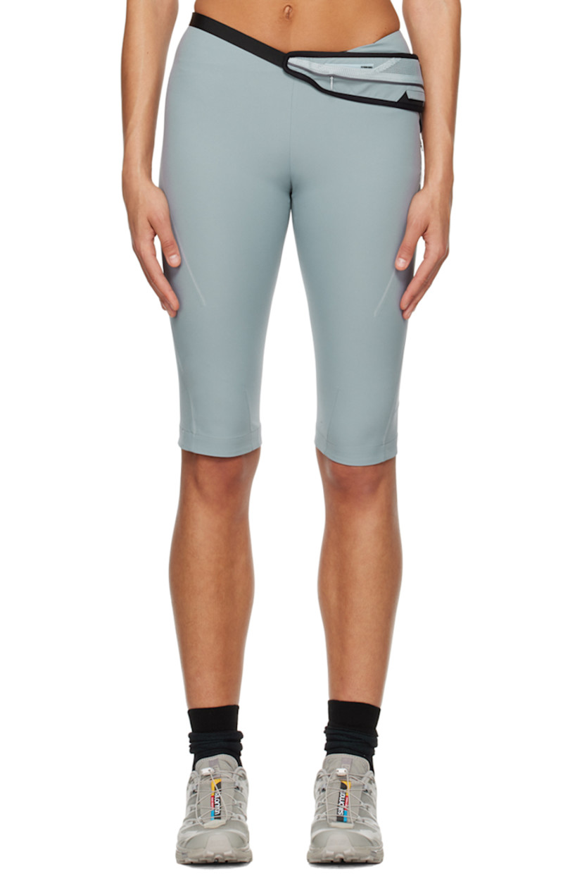 Polyester crepe shorts. Belt-style pouch with zip compartment at waist.

· Two-pocket styling
· Concealed zip closure at outseam
· Rubberized logo patch at outseam
· Reflective trim at outseams

Supplier color: Ash blue