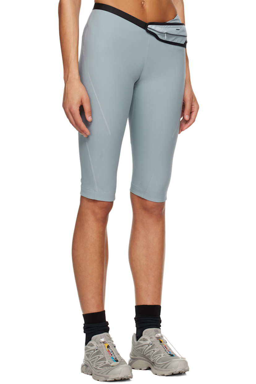 Polyester crepe shorts. Belt-style pouch with zip compartment at waist.

· Two-pocket styling
· Concealed zip closure at outseam
· Rubberized logo patch at outseam
· Reflective trim at outseams

Supplier color: Ash blue
