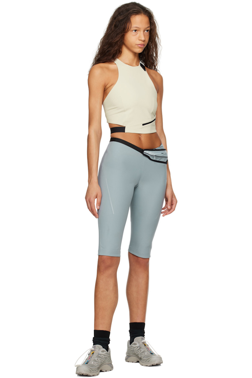 Polyester crepe shorts. Belt-style pouch with zip compartment at waist.

· Two-pocket styling
· Concealed zip closure at outseam
· Rubberized logo patch at outseam
· Reflective trim at outseams

Supplier color: Ash blue