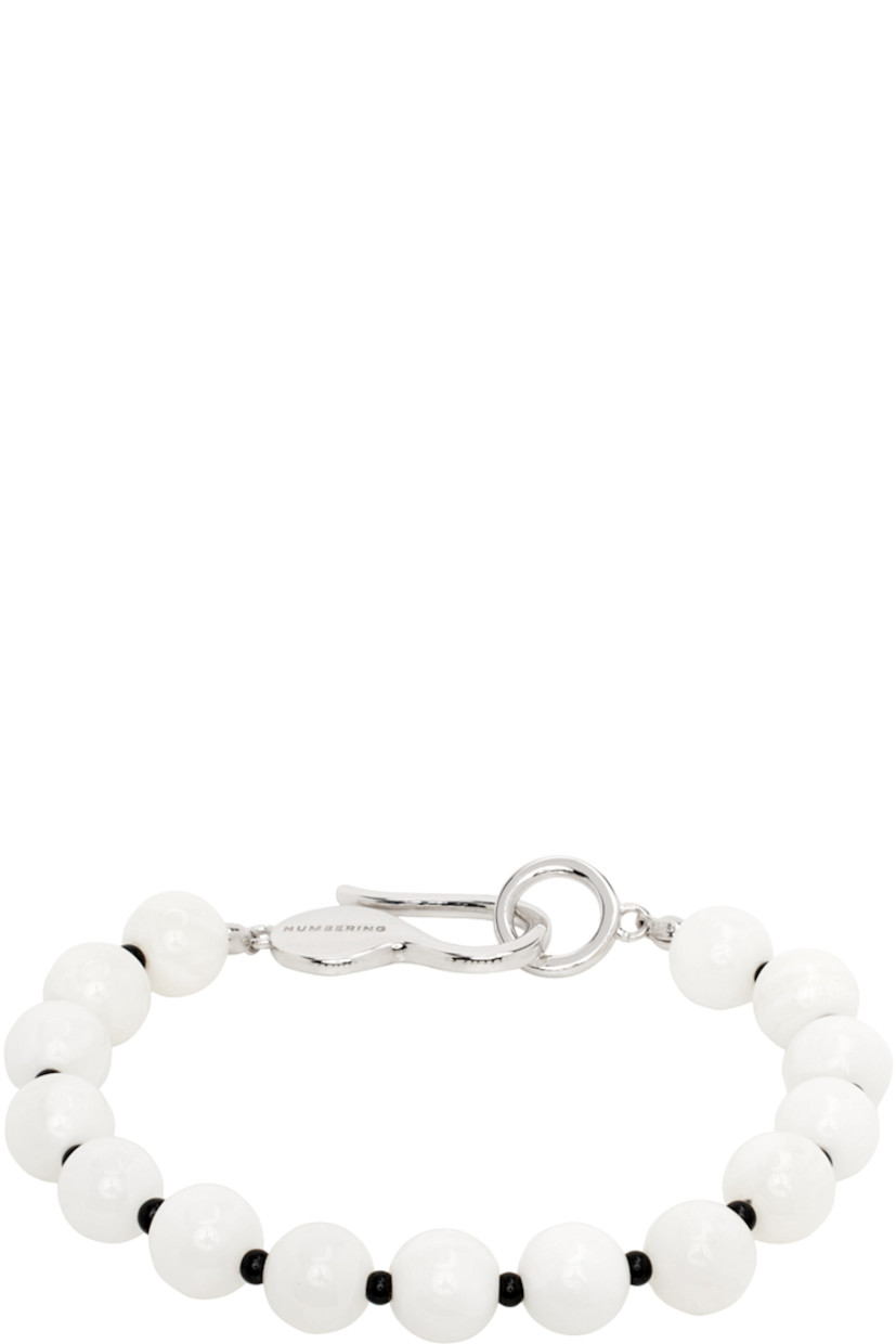 Beaded mother-of-pearl bracelet in white. Logo-engraved rhodium-plated sterling silver hook-eye fastening.

Supplier color: White