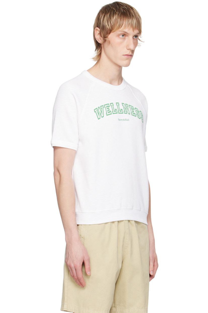 Pre-shrunk cotton- and polyester-blend fleece T-shirt. 

· Rib knit crewneck, hem, and cuffs
· Text and logo printed at front 
· Raglan sleeves

Supplier color: White/Verde