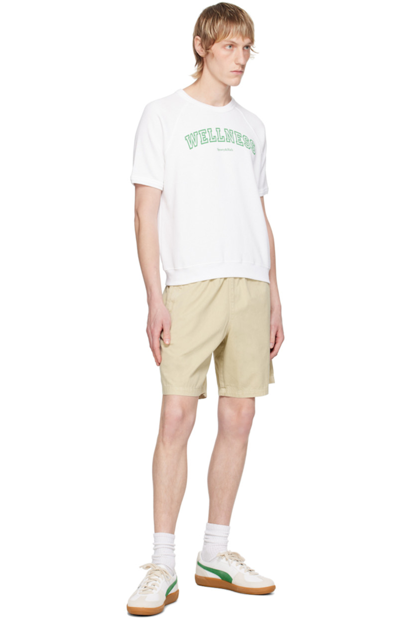 Pre-shrunk cotton- and polyester-blend fleece T-shirt. 

· Rib knit crewneck, hem, and cuffs
· Text and logo printed at front 
· Raglan sleeves

Supplier color: White/Verde