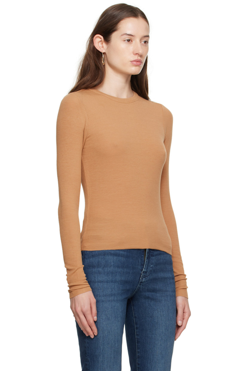 Rib knit stretch modal T-shirt. 

· Crewneck
· Raw edge at hem and cuffs
· Logo embroidered at side seam
· Flatlock seam at back

Supplier color: Camel