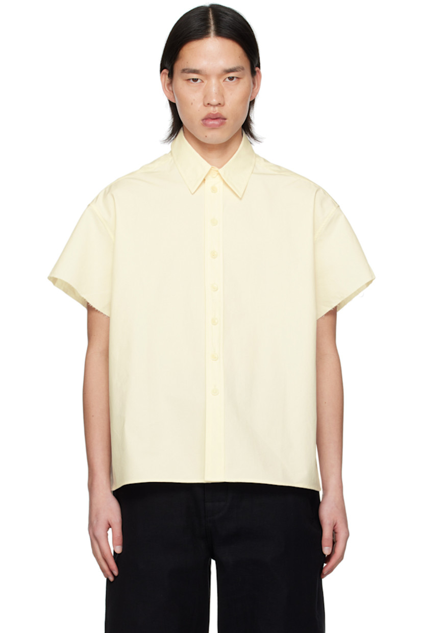 Cotton poplin shirt.

· Spread collar
· Button closure
· Shirttail hem
�· Raw edge at cuffs
· Logo embroidered at back collar
· Inverted box pleat at back yoke 

Supplier color: Natural