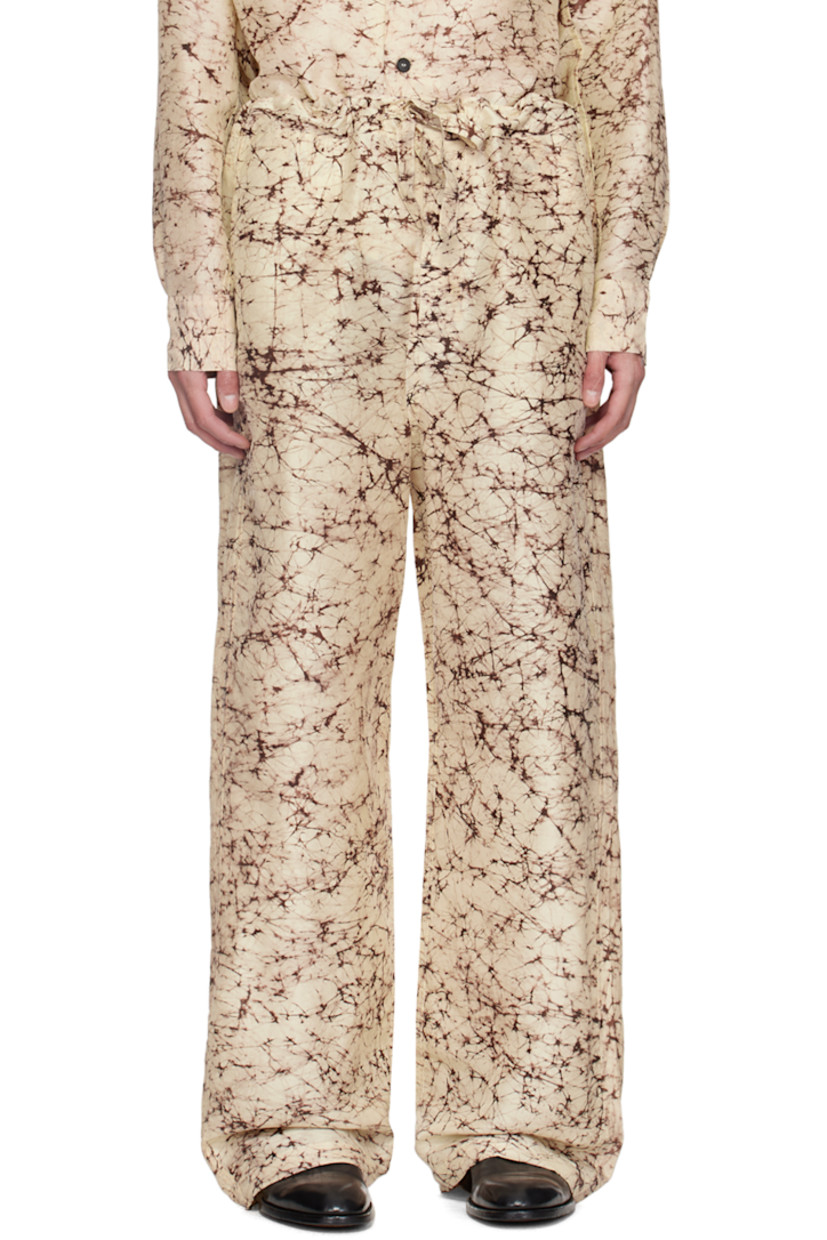 Plain-woven silk trousers. Raw edges and printed graphic pattern throughout.

· Drawstring at waistband
· Four-pocket styling
· Button-fly
· Logo embroidered at back

Supplier color: Natural