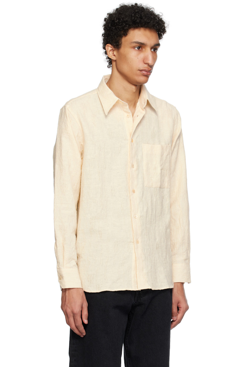 Slub cotton canvas shirt. Distressing and laddering throughout.

· Spread collar
· Button closure
· Patch pocket
· Dropped shirttail hem
· Adjustable single-button barrel cuffs
· Box pleat at back yoke

Supplier color: Off white