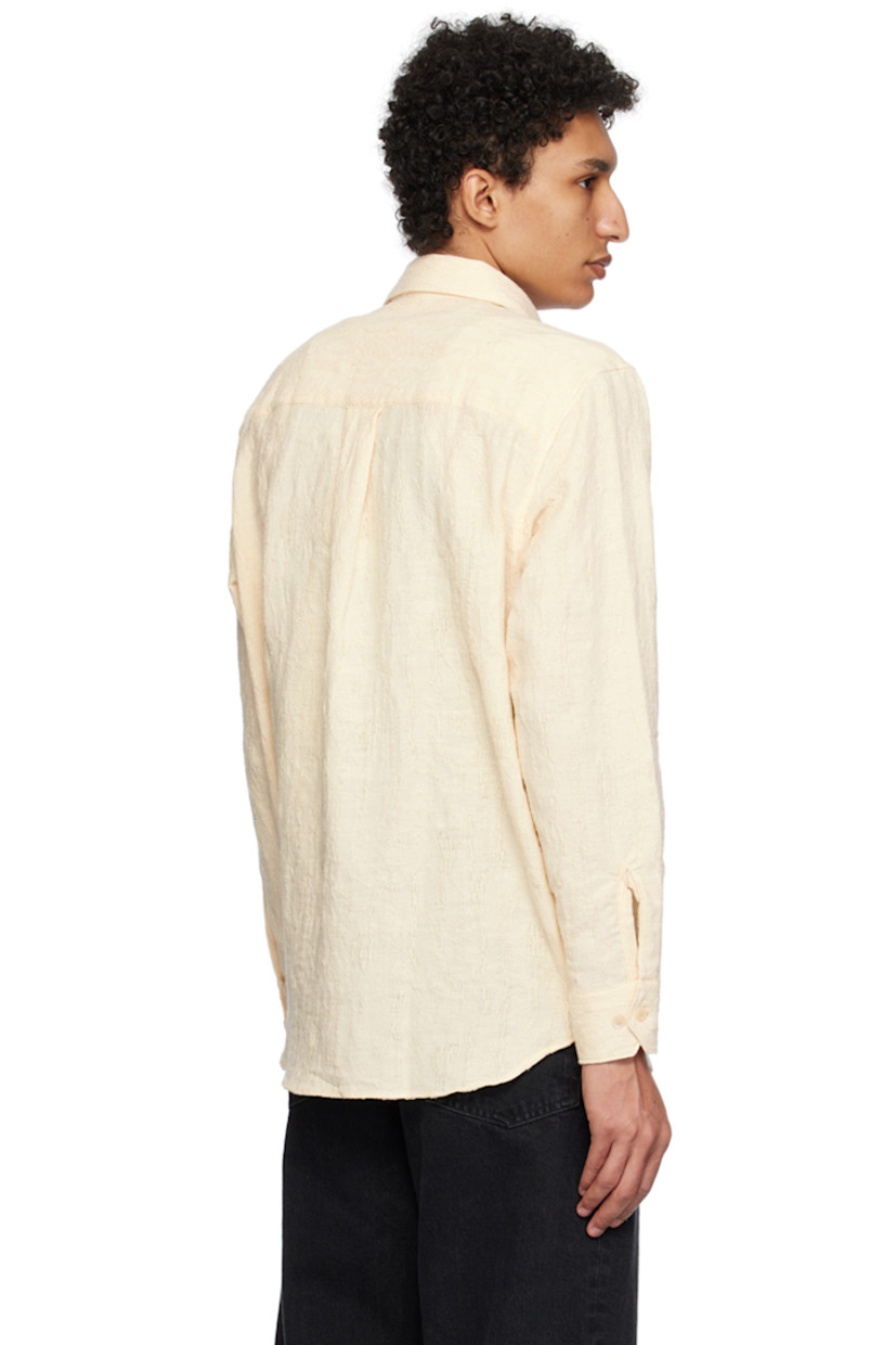 Slub cotton canvas shirt. Distressing and laddering throughout.

· Spread collar
· Button closure
· Patch pocket
· Dropped shirttail hem
· Adjustable single-button barrel cuffs
· Box pleat at back yoke

Supplier color: Off white