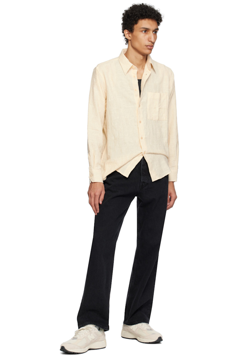 Slub cotton canvas shirt. Distressing and laddering throughout.

· Spread collar
· Button closure
· Patch pocket
· Dropped shirttail hem
· Adjustable single-button barrel cuffs
· Box pleat at back yoke

Supplier color: Off white
