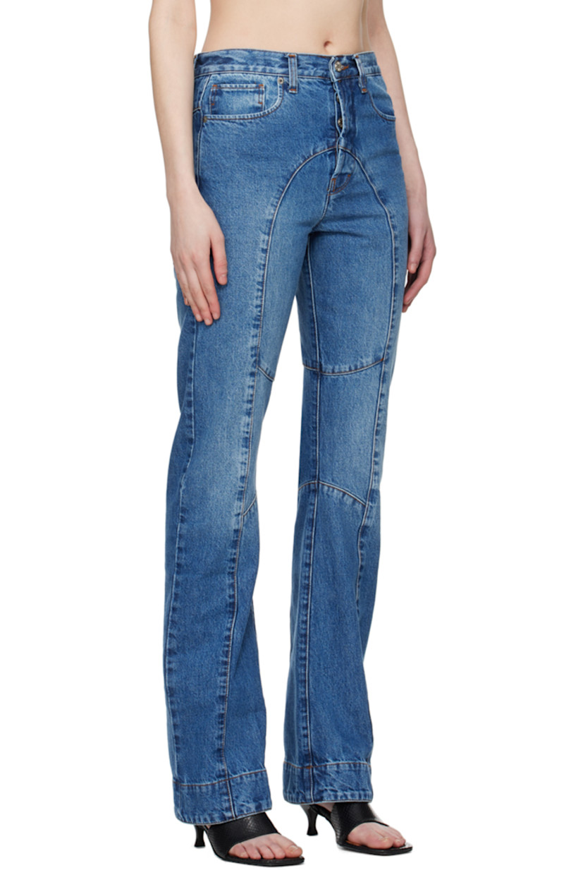 Non-stretch recycled cotton-blend denim jeans. Fading throughout.

· Paneled construction
· Belt loops
· Five-pocket styling
· Button-fly
· Logo patch at back waistband
· Graphic embroidered at back pockets
· Contrast stitching in tan

Supplier color: Blue