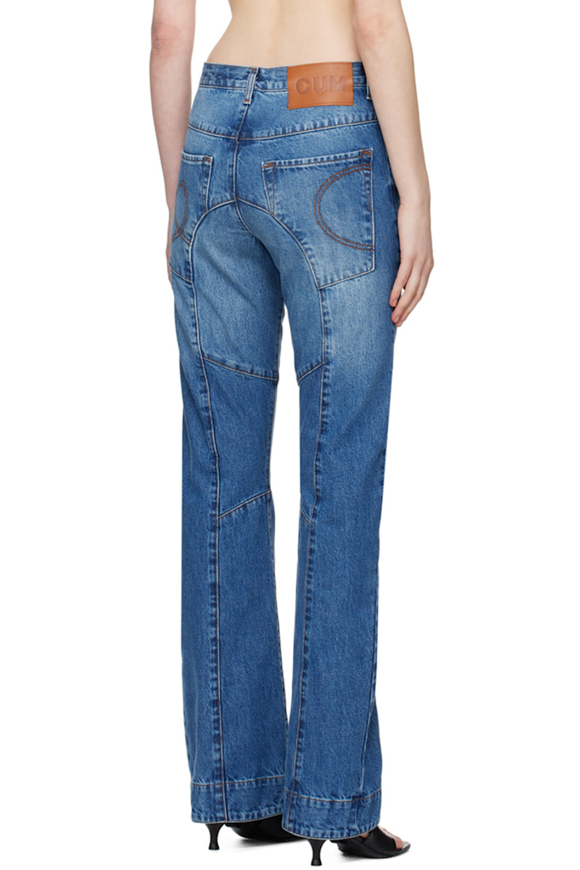 Non-stretch recycled cotton-blend denim jeans. Fading throughout.

· Paneled construction
· Belt loops
· Five-pocket styling
· Button-fly
· Logo patch at back waistband
· Graphic embroidered at back pockets
· Contrast stitching in tan

Supplier color: Blue