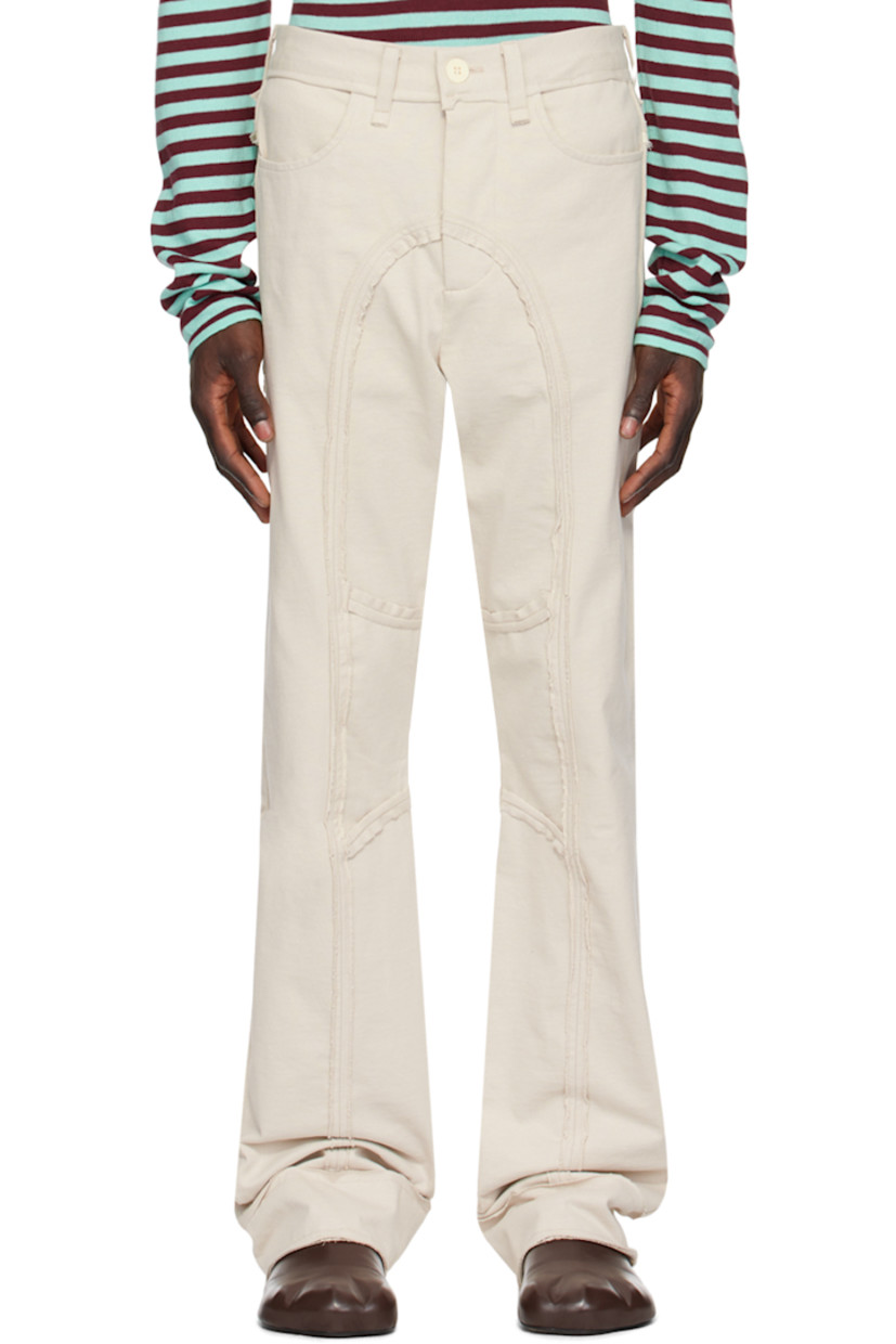 Organic cotton jersey jeans. Raw edges throughout. 

· Paneled construction 
· Belt loops
· Four-pocket styling 
· Rolled edge at cuffs
· Gusset at inseam

Supplier color: Cream