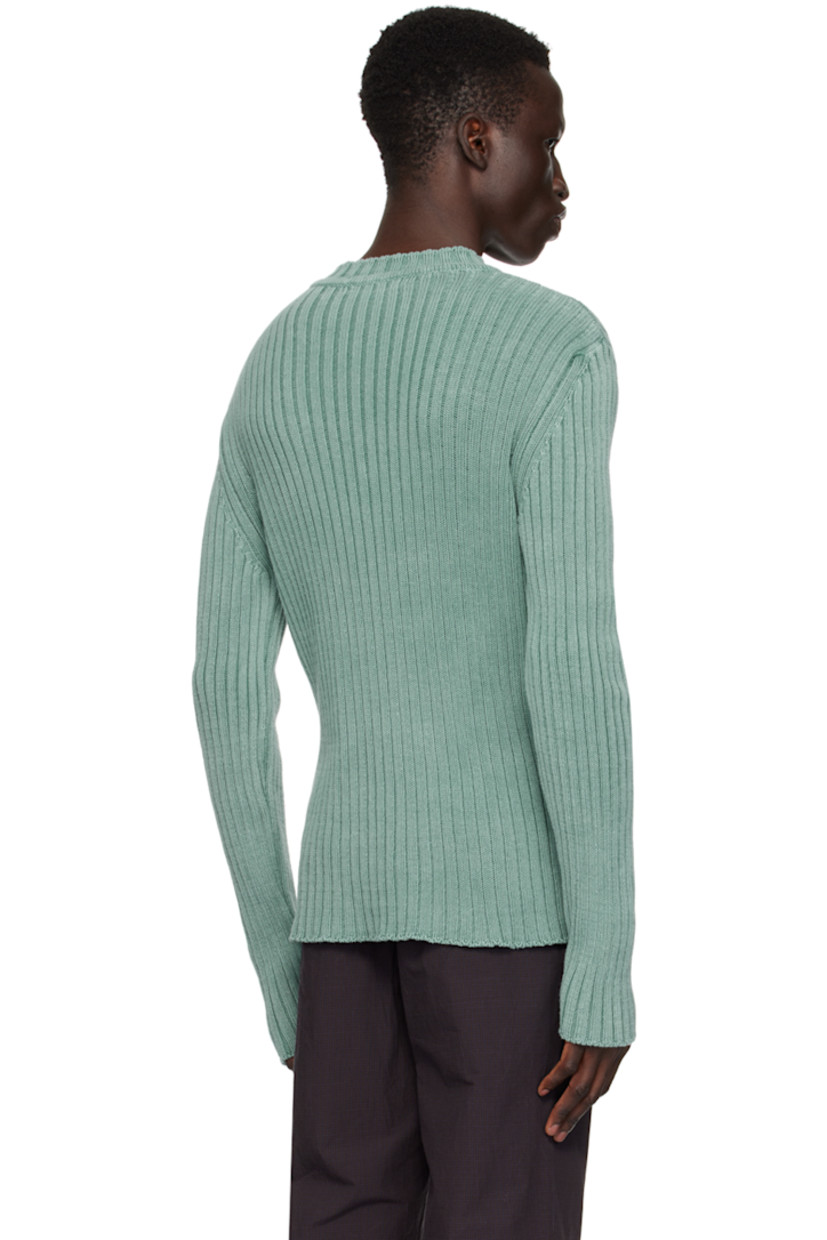Rib knit cotton sweater. Fading throughout. 

· Crewneck 
· Graphic printed at front 

Supplier color: Washed aqua