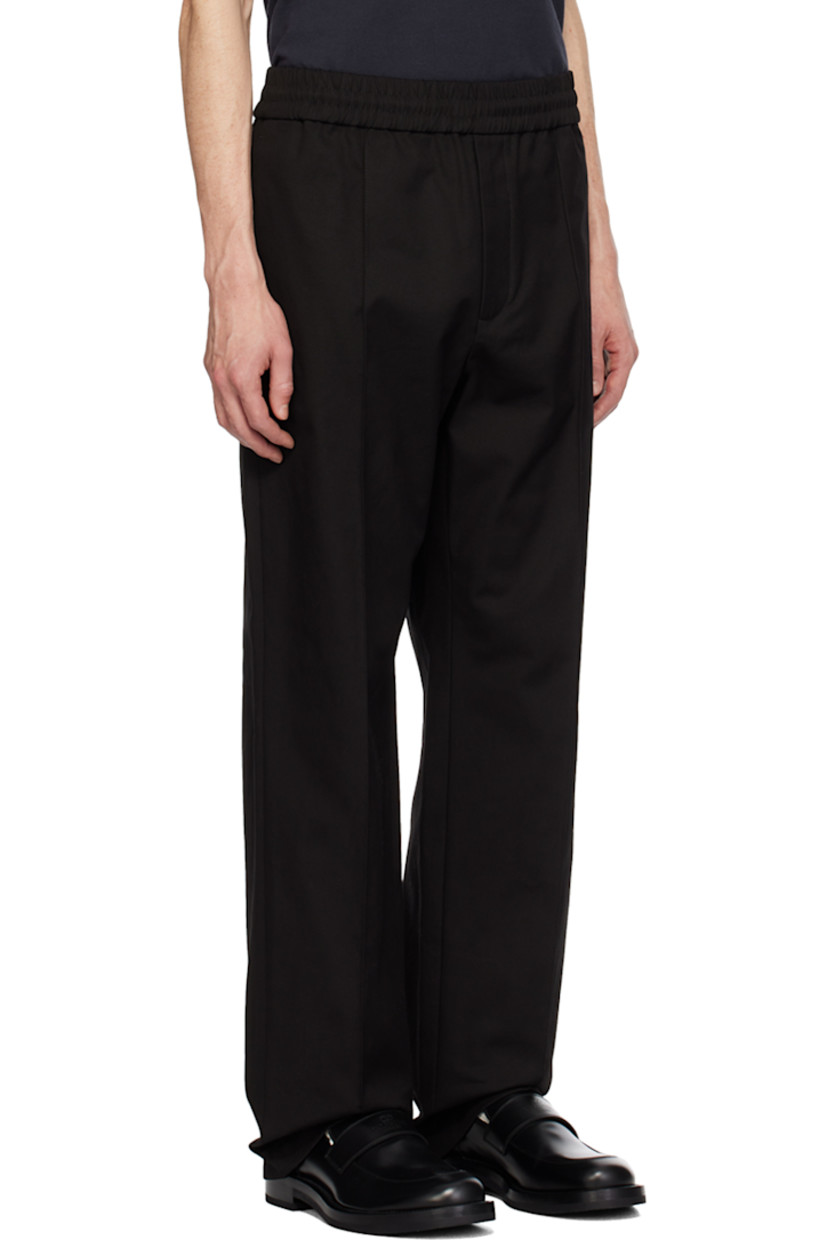 Stretch cotton canvas trousers.

· Concealed drawstring at elasticized waistband
· Four-pocket styling
· Zip-fly
· Pinched seams at front 
· Logo hardware at back pocket
· Central creases at back

Supplier color: Nero
