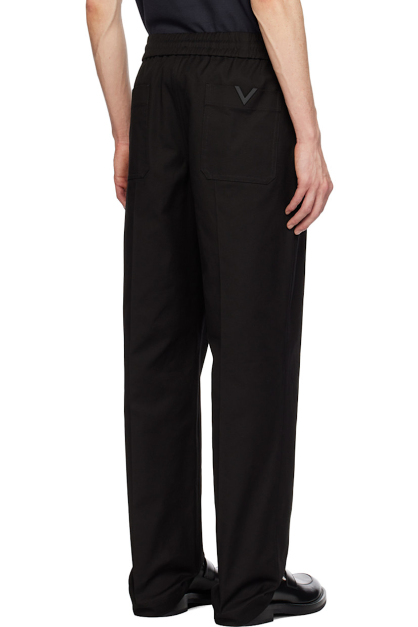 Stretch cotton canvas trousers.

· Concealed drawstring at elasticized waistband
· Four-pocket styling
· Zip-fly
· Pinched seams at front 
· Logo hardware at back pocket
· Central creases at back

Supplier color: Nero