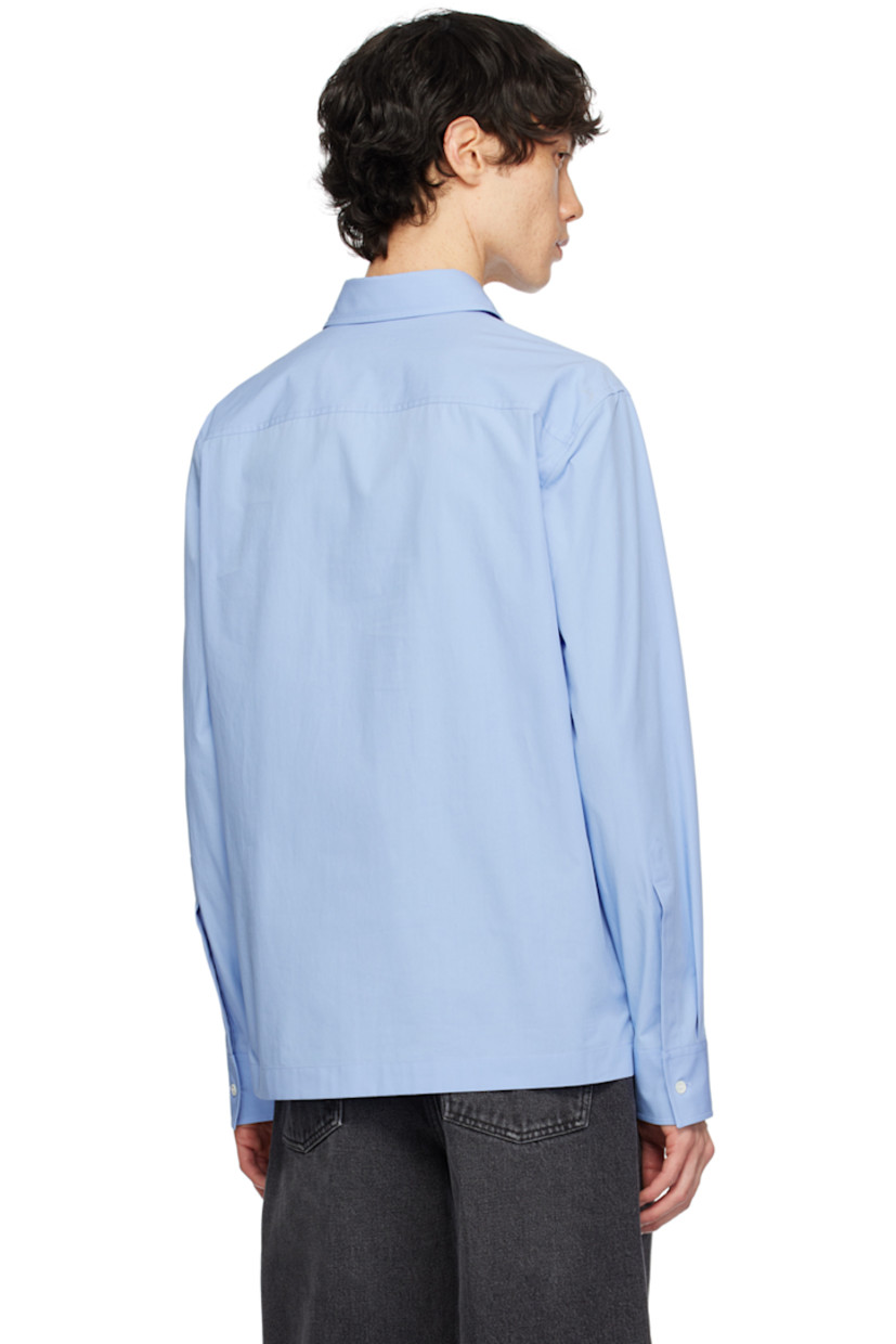 Cotton poplin shirt.

· Spread collar
· Four-button placket
· Logo cutout at patch pocket
· Vented side seams
· Single-button barrel cuffs
· Logo-engraved hardware 

Supplier color: Iris lilac