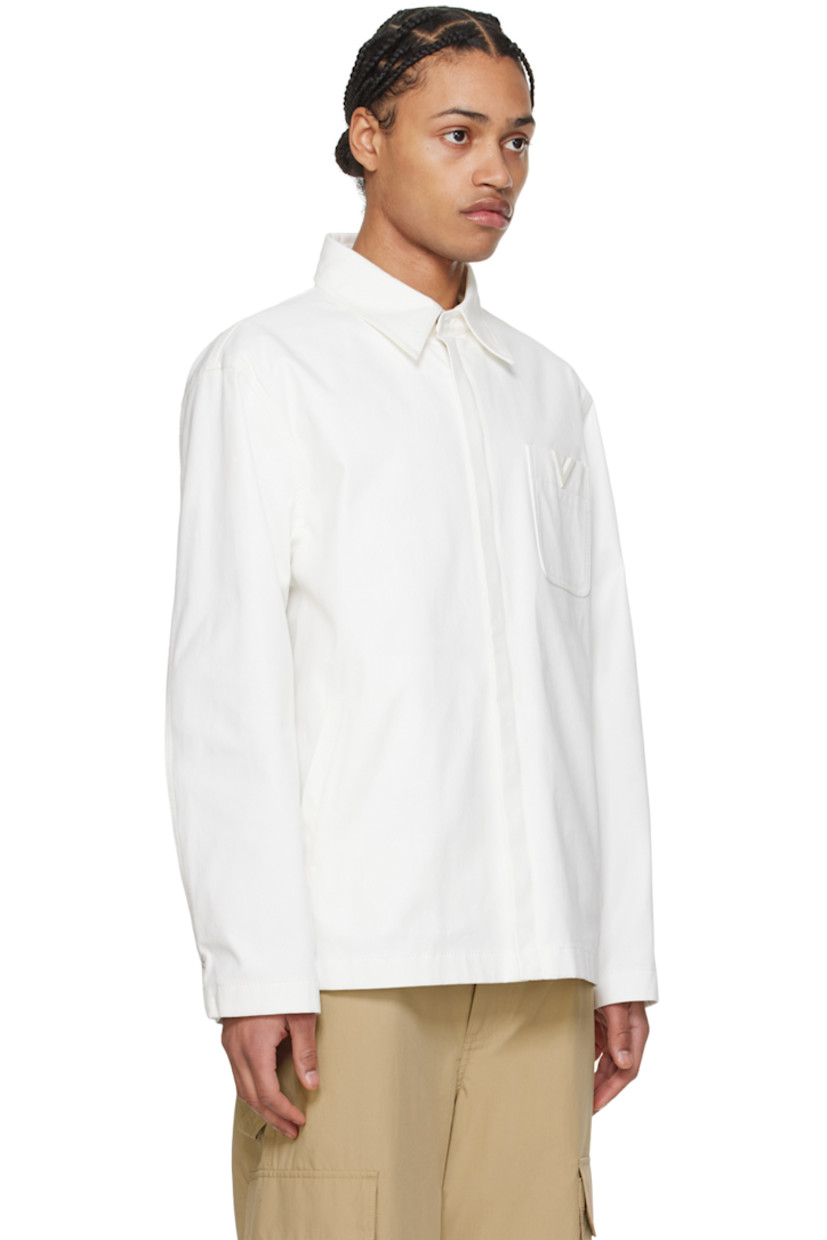Stretch cotton canvas jacket. 

· Spread collar
· Zip closure
· Logo hardware at chest
· Patch and welt pockets
· Adjustable press-stud fastening at cuffs
· Patch pocket at interior
· Full cotton poplin lining

Supplier color: Avorio