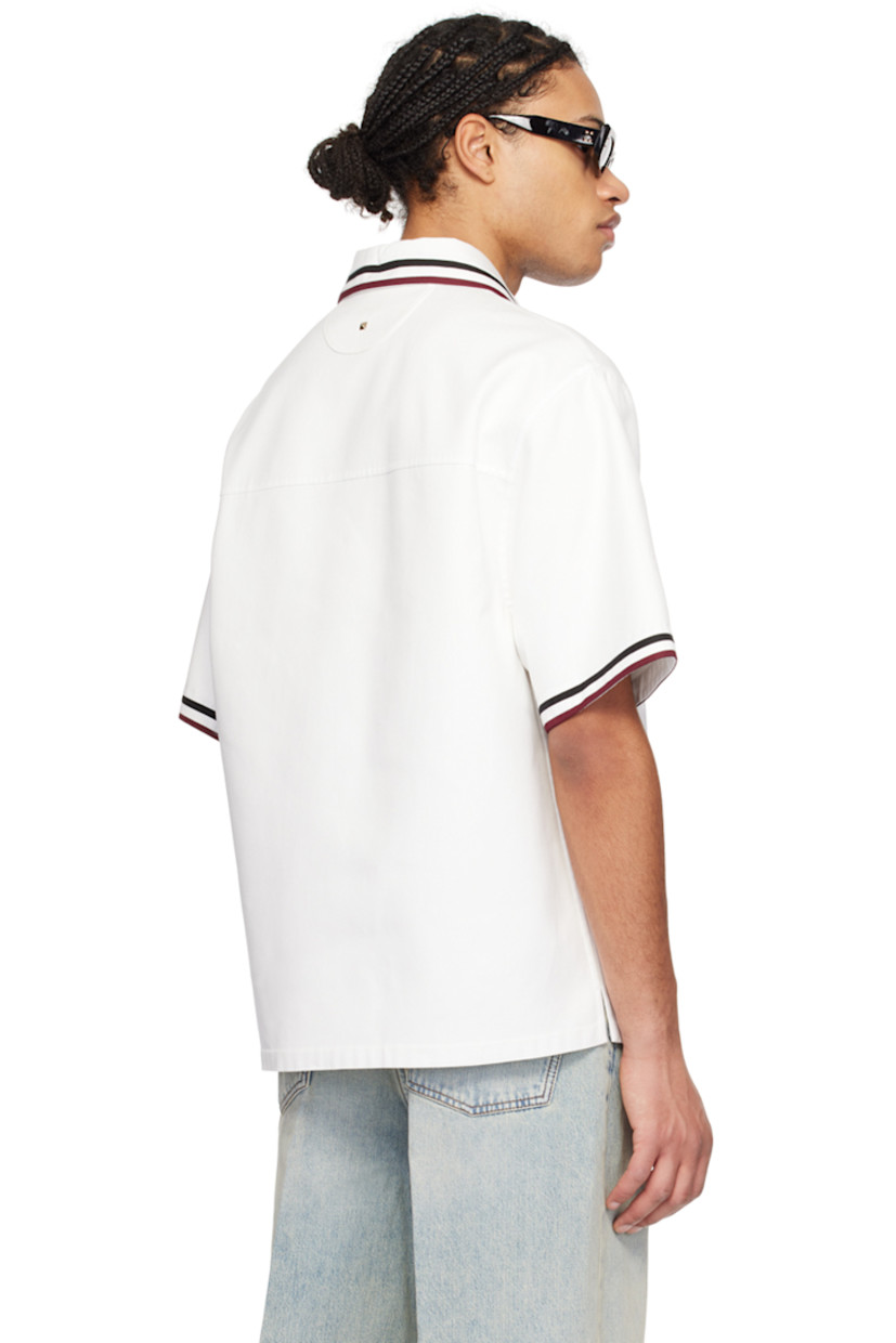Cotton-blend twill polo. 

· Stripes at spread collar and cuffs
· Three-button closure
· Patch pocket at chest
· Vent at side seams
· Logo hardware at back yoke

Supplier color: Bianco/Nero/Bordeaux