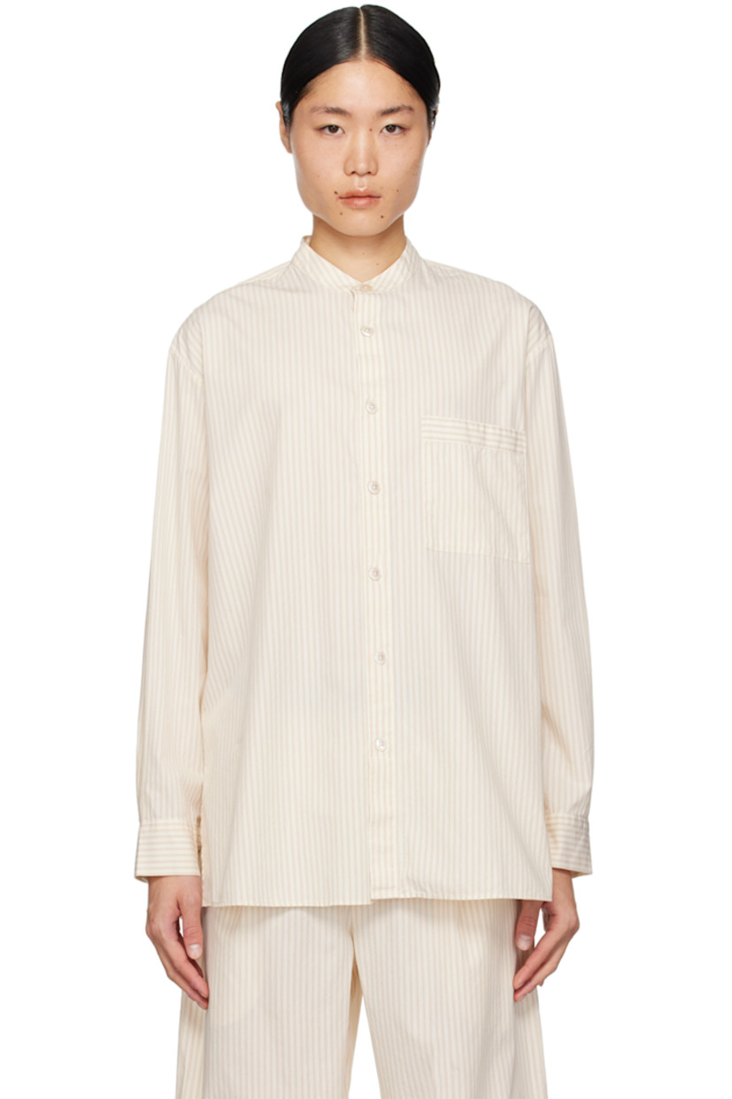Stonewashed lightweight 122 gsm OEKO-TEX® Standard 100-certified organic cotton poplin pyjama shirt. Stripes throughout.

· Band collar
· Button closure
· Patch pocket at chest
· Vents at shirttail hem
· Box pleat at back yoke
· Mother-of-pearl hardware

Part of the Tekla x Birkenstock collaboration.

Supplier color: Wheat stripes