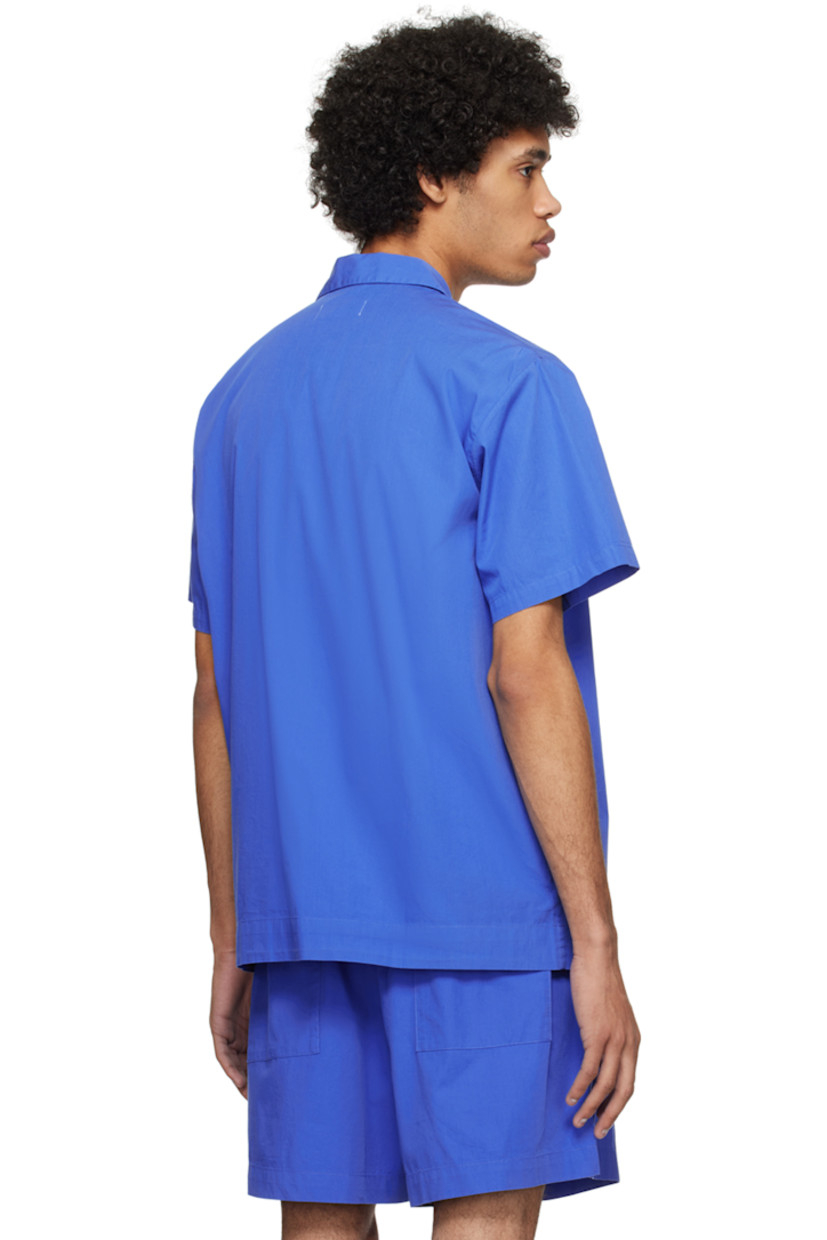 Lightweight OEKO-TEX® Standard 100-certified organic cotton poplin pyjama shirt. 

· Spread collar
· Button closure
· Patch pocket at chest
· Mother-of-pearl hardware

Supplier color: Royal blue