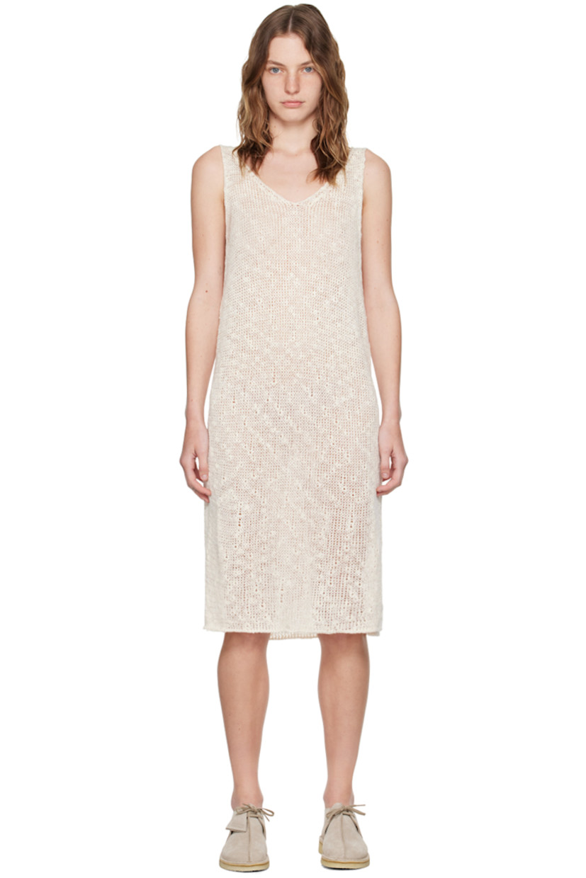 Open knit silk- and cotton-blend dress.

· V-neck
· Vented side seams
· Rolled edge at hem

Supplier color: Ivory