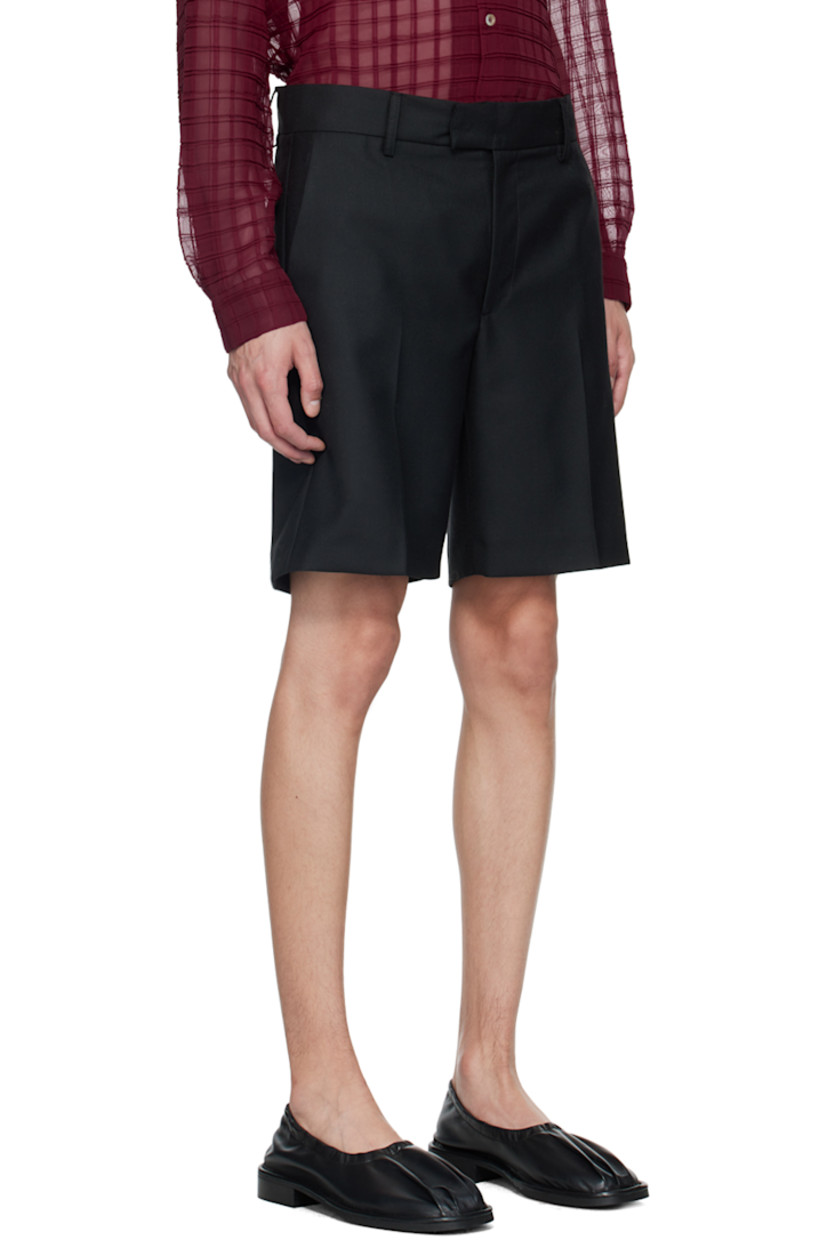 Wide-leg lightweight polyester- and wool-blend twill shorts.

· Belt loops
· Four-pocket styling
· Zip-fly
· Creased legs

Supplier color: Black
