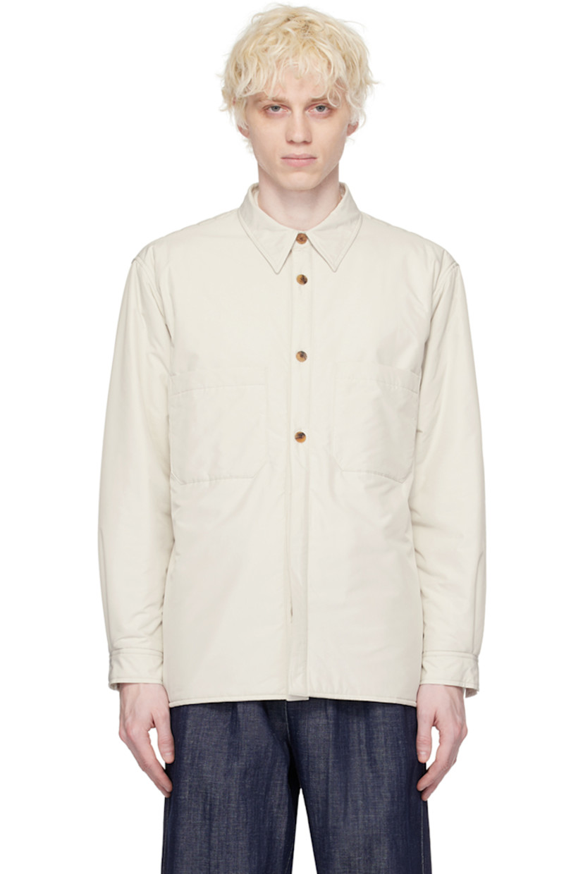 Insulated polyester taffeta jacket. 

· Spread collar
· Button closure 
· Patch and welt pockets 
· Vented side seams
· Quilted panel at shoulders and back
· Two-button barrel cuffs 

Supplier color: Ivory