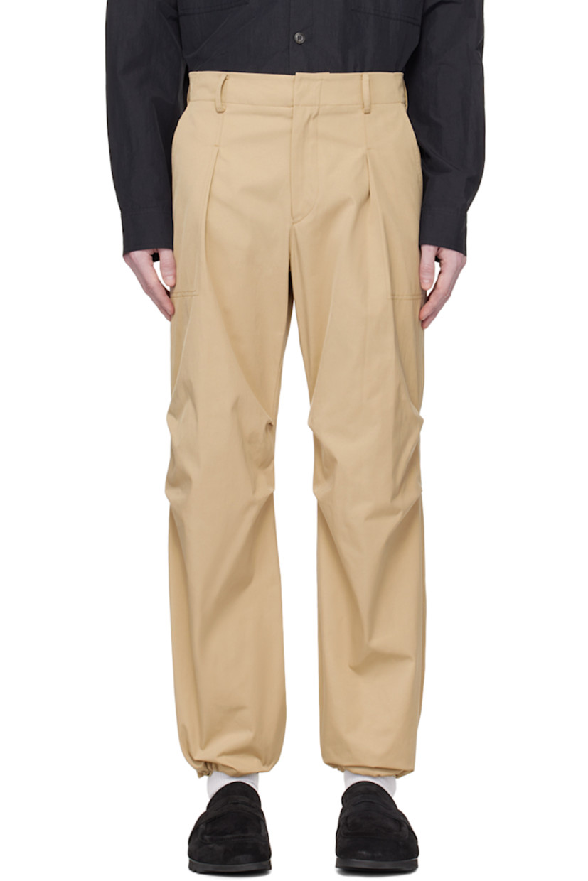 Polyester- and nylon-blend taffeta trousers. 

· Belt loops at partially elasticized waistband
· Four-pocket styling 
· Zip-fly 
· Pleats at front 
· Bungee-style drawstring at cuffs 
· Darts at back waistband 

Supplier color: Beige