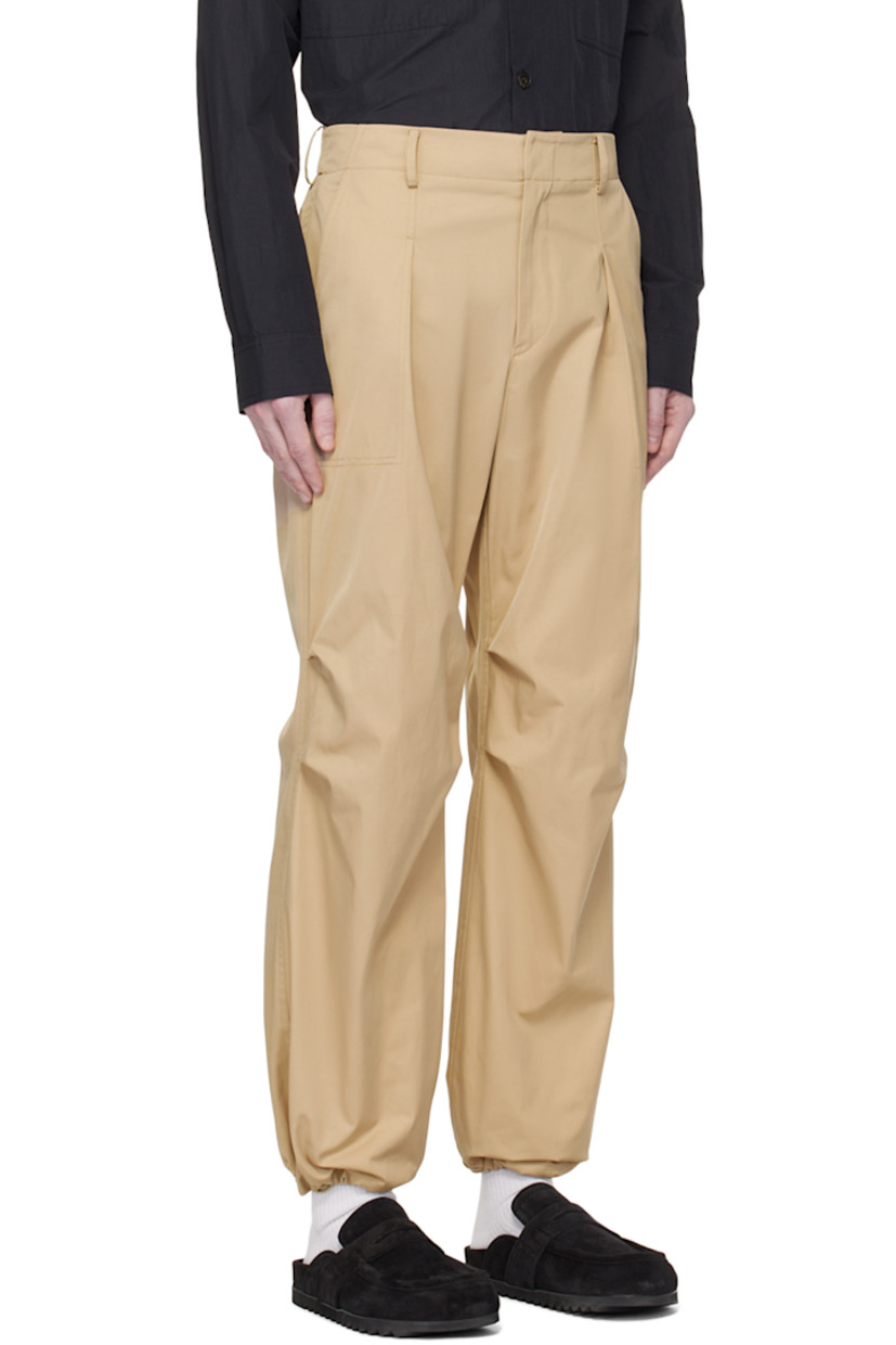 Polyester- and nylon-blend taffeta trousers. 

· Belt loops at partially elasticized waistband
· Four-pocket styling 
· Zip-fly 
· Pleats at front 
· Bungee-style drawstring at cuffs 
· Darts at back waistband 

Supplier color: Beige