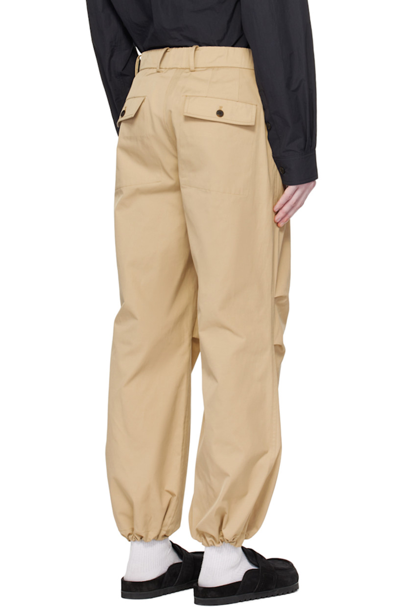 Polyester- and nylon-blend taffeta trousers. 

· Belt loops at partially elasticized waistband
· Four-pocket styling 
· Zip-fly 
· Pleats at front 
· Bungee-style drawstring at cuffs 
· Darts at back waistband 

Supplier color: Beige