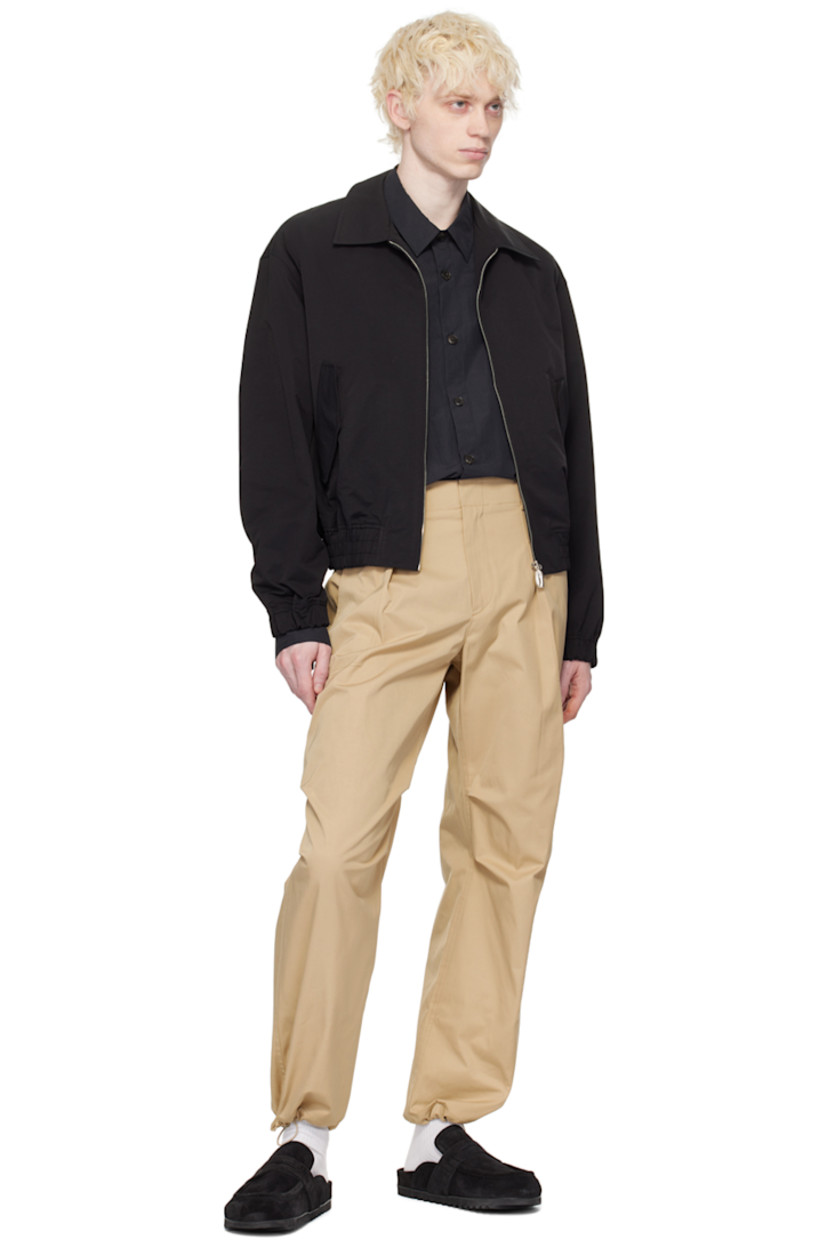 Polyester- and nylon-blend taffeta trousers. 

· Belt loops at partially elasticized waistband
· Four-pocket styling 
· Zip-fly 
· Pleats at front 
· Bungee-style drawstring at cuffs 
· Darts at back waistband 

Supplier color: Beige