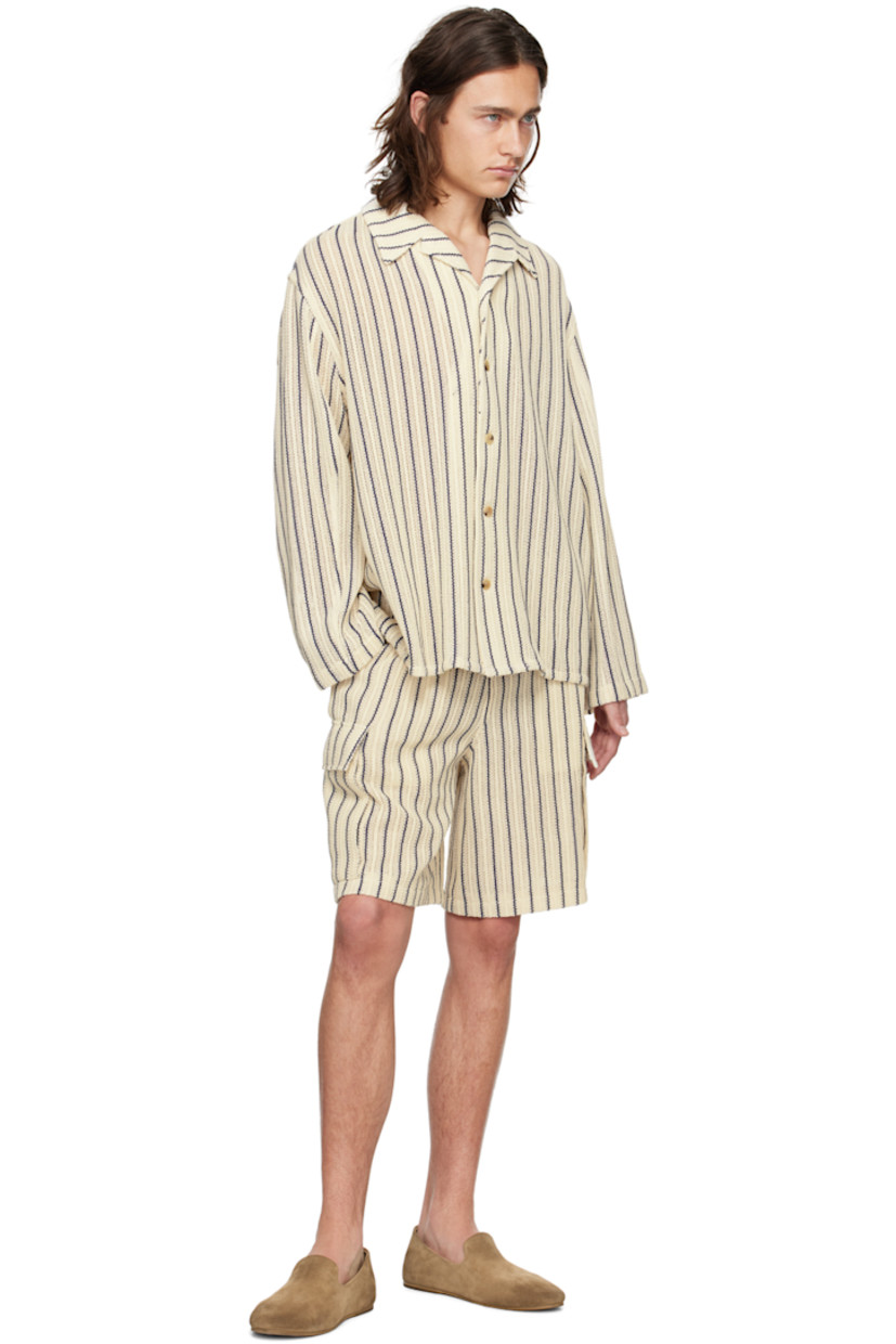 Open knit cotton shorts. Jacquard stripes throughout.  

· Elasticized waistband 
· Two-pocket styling 
· Flap pockets at outseams 
· Full mesh lining

Supplier color: Blue