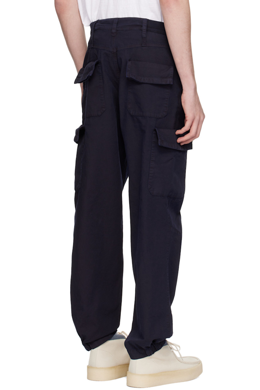 Cotton canvas cargo pants. 

· Belt loops
· Partial rib knit trim at waistband 
· Four-pocket styling 
· Button-fly
· D-ring at front
· Darts at knees
· Partially elasticized cuffs
· Cargo pockets at outseams

Supplier color: Navy