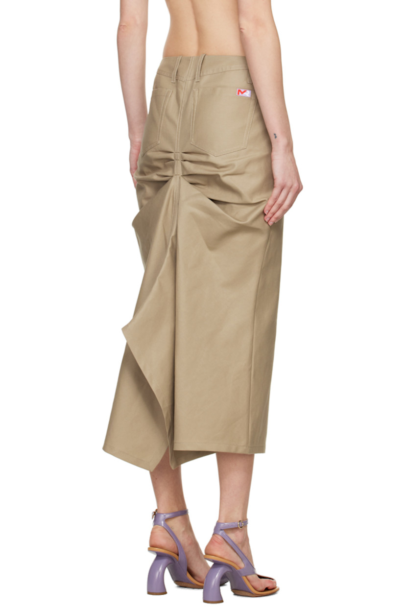 Cotton twill skirt. 

· Belt loops
· Four-pocket styling
· Zip-fly
· Asymmetric hem
· Central vent at front hem
· Ruching and draping at back

Supplier color: Clay