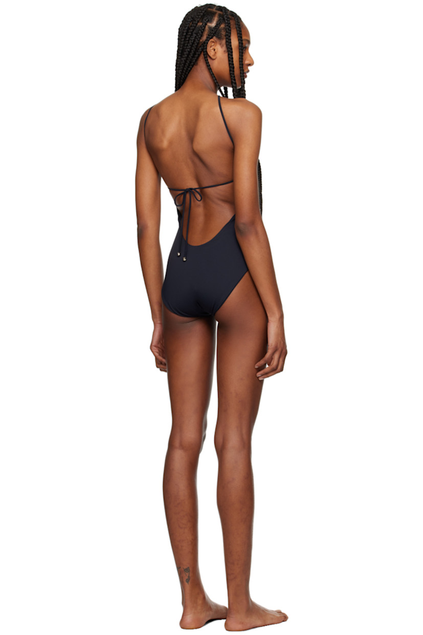 XTRA LIFE™ stretch ECONYL® nylon jersey one-piece swimsuit.

· O-ring at halter neck
· Fixed shoulder straps
· Self-tie fastening at back
· Fully lined
· Silver-tone hardware

Supplier color: Black