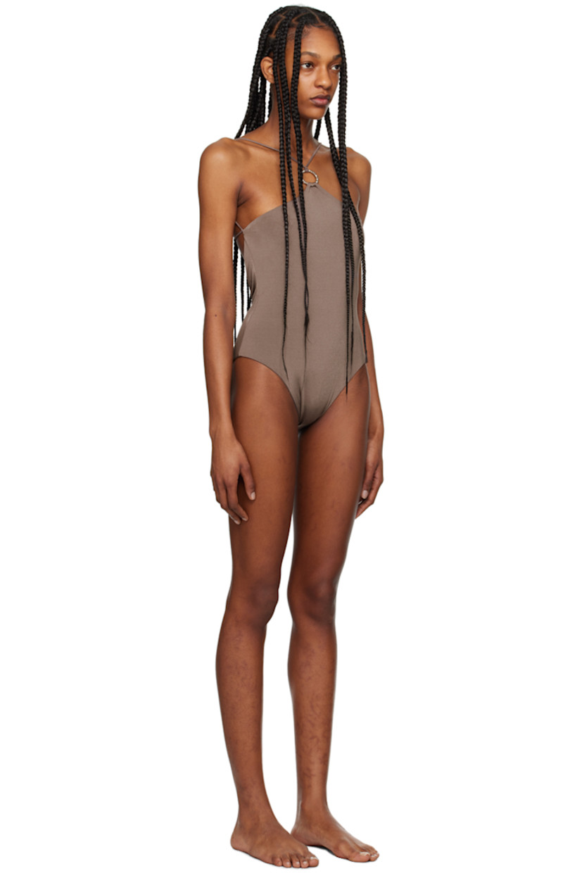 XTRA LIFE™ stretch ECONYL® nylon jersey one-piece swimsuit.

· O-ring at halter neck
· Fixed shoulder straps
· Self-tie fastening at back
· Fully lined
· Silver-tone hardware

Supplier color: Brown