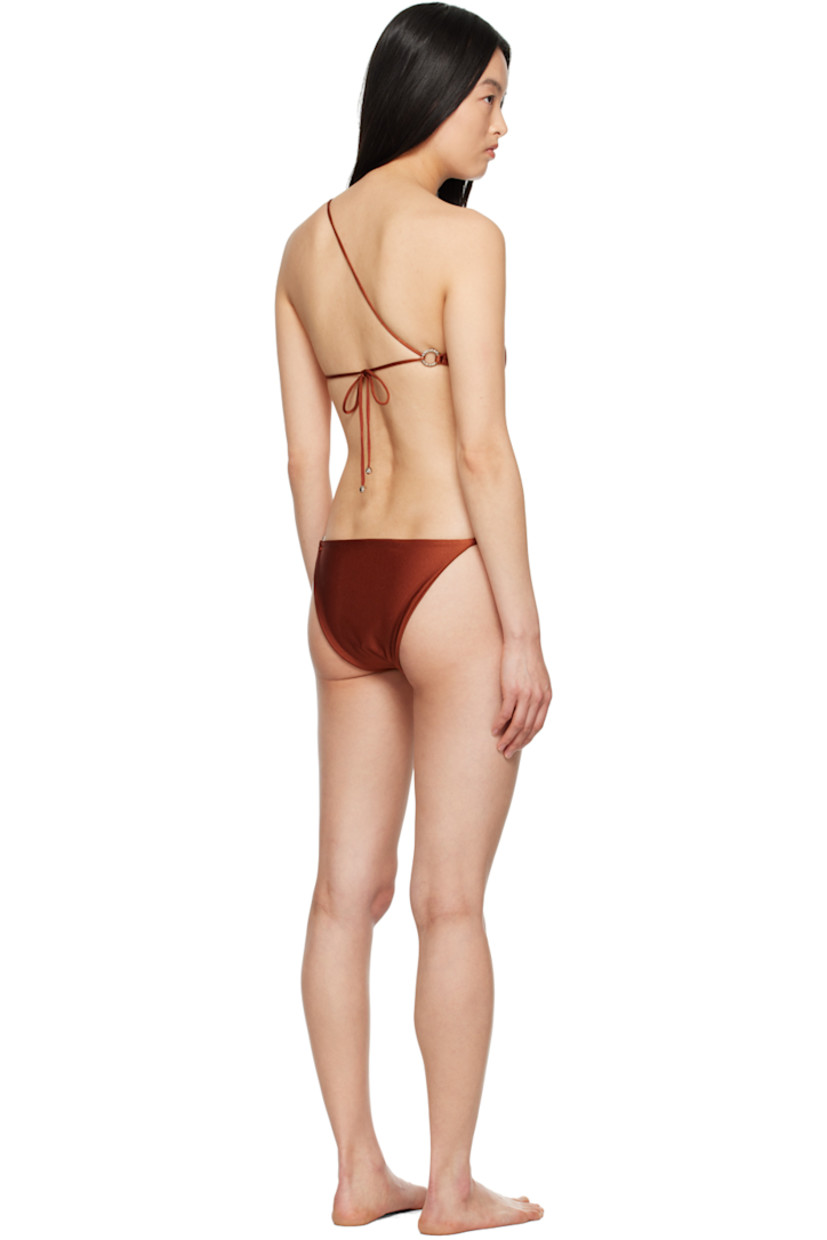 Stretch nylon jersey bikini top.

· Single-shoulder construction
· O-ring at shoulder strap
· Self-tie fastening at back
· Fully lined
· Sculptural silver-tone hardware

Stretch nylon jersey bikini bottom.

· O-ring at side seam
· Fully lined
· Sculptural silver-tone hardware

Supplier color: Coral
