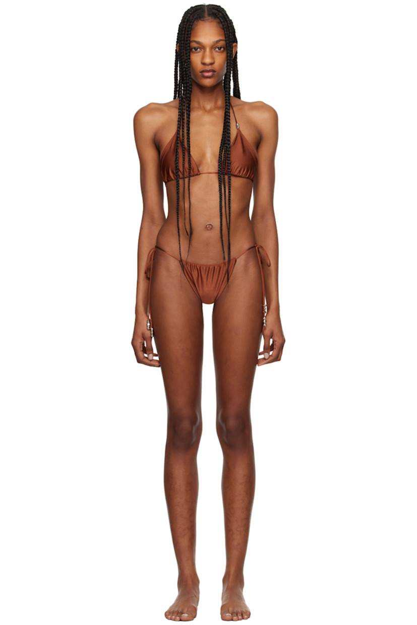 XTRA LIFE™ stretch ECONYL® nylon jersey bikini top.

· Self-tie halter strap
· Gathering at cups
· Self-tie fastening at back
· Fully lined
· Silver-tone hardware

XTRA LIFE™ stretch ECONYL® nylon jersey bikini bottom.

· Self-tie fastening at sides
· Fully lined
· Silver-tone hardware

Supplier color: Coral