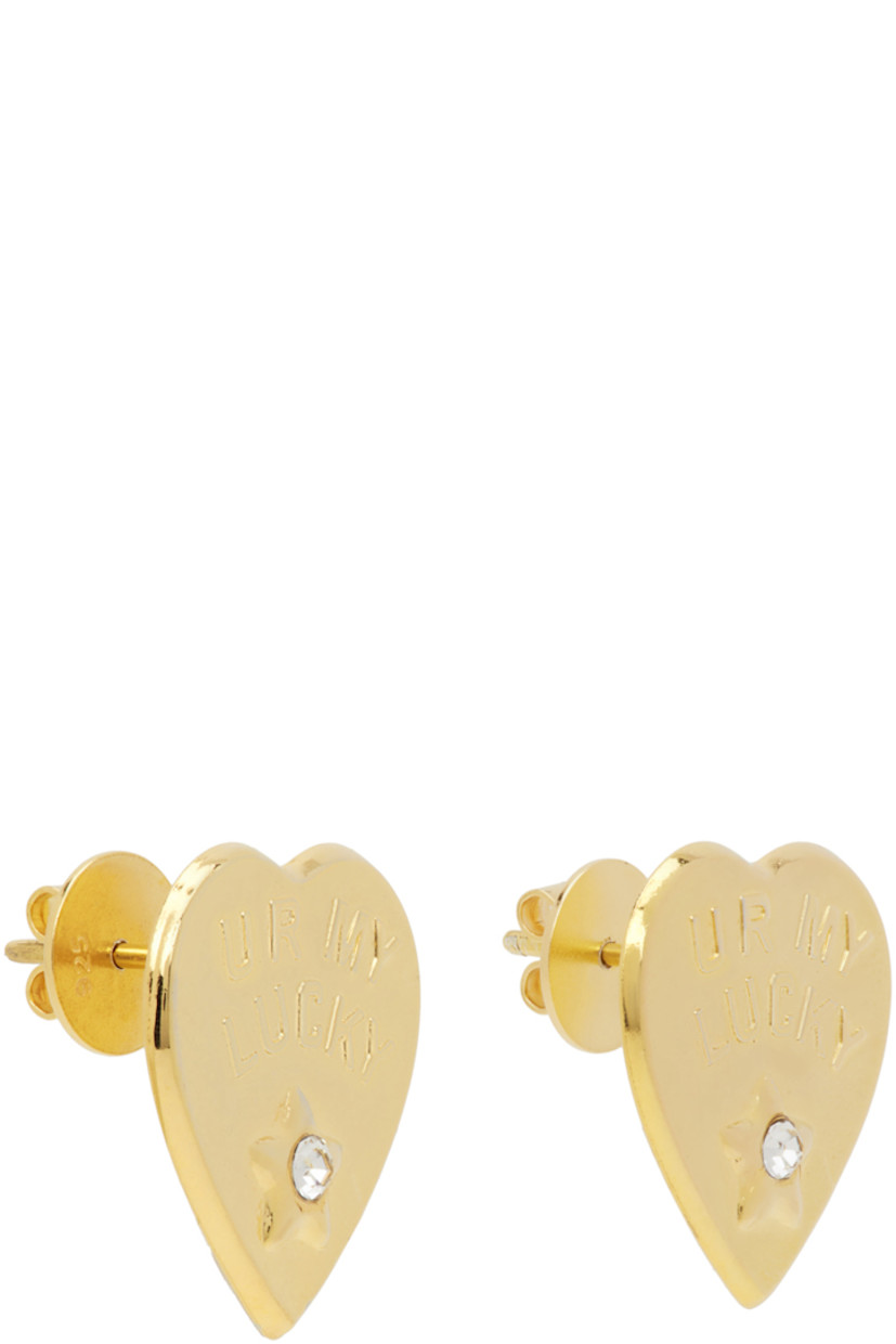 Pair of graphic stud earrings in gold-tone brass.

· Text embossed at face
· Crystal-cut accent at face
· Post-stud fastening
· D0.75" 

Supplier color: Gold
