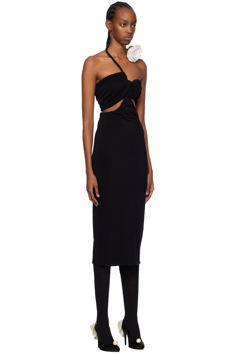 Stretch nylon crepe dress. Gathering and draping throughout. 

· Covered wire trim at modified sweetheart neck
· Floral appliqué at wire
· Twisted detailing at chest 
· Cut-outs at chest and side seams
· Zip closure at back 
· Vented back hem 

Supplier color: Black