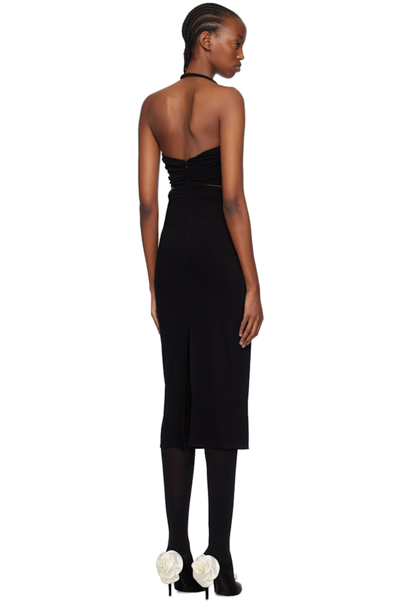 Stretch nylon crepe dress. Gathering and draping throughout. 

· Covered wire trim at modified sweetheart neck
· Floral appliqué at wire
· Twisted detailing at chest 
· Cut-outs at chest and side seams
· Zip closure at back 
· Vented back hem 

Supplier color: Black
